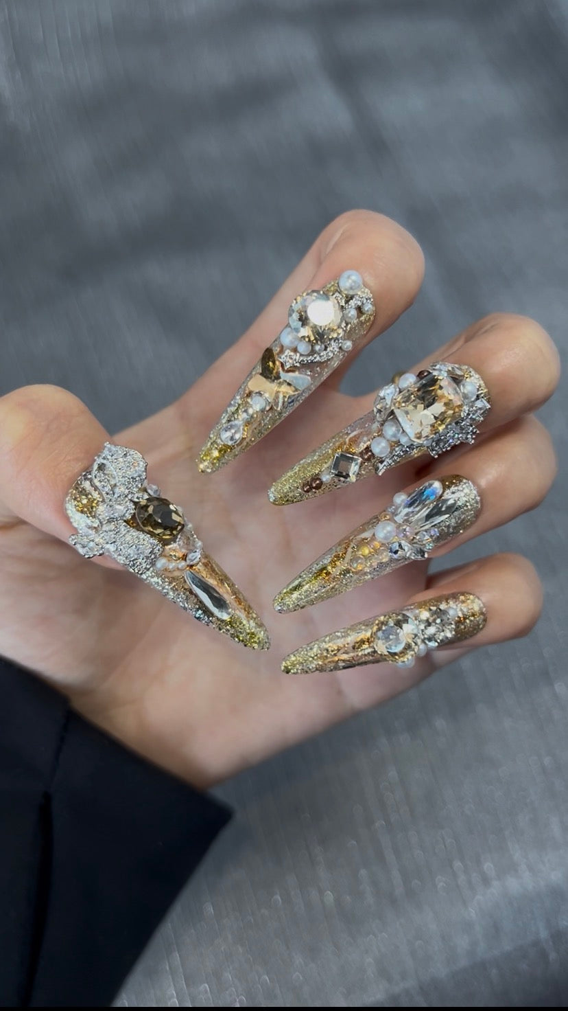 Gold crystal wearable nail art close-up
