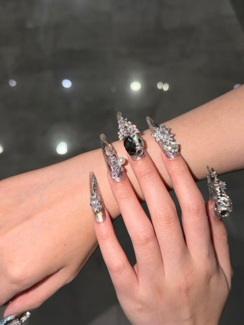 Silver embellished press-on nails styled for another occasion