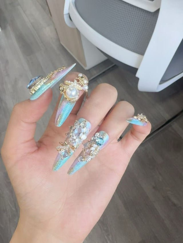 Blue pearl and crystal press-on nails with wearable nail art details
